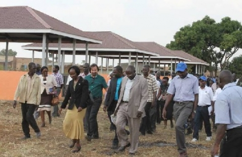 Officials inspecting market sheds during commissioning in Labongo Ogali